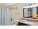 Clean bathroom with granite vanity and updated fixtures at 4676 Vinings Central Se Run # 104, Atlanta, GA 30339