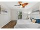 Bright bedroom with wood floors and ceiling fan at 4676 Vinings Central Se Run # 104, Atlanta, GA 30339