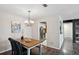 Dining area with wood table and view into kitchen at 4676 Vinings Central Se Run # 104, Atlanta, GA 30339