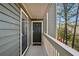 Private entrance with dark-grey door and white railing at 4676 Vinings Central Se Run # 104, Atlanta, GA 30339