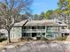 Front view of a green two-story building with parking at 4676 Vinings Central Se Run # 104, Atlanta, GA 30339