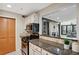 Kitchen with granite countertops and view to living room at 4676 Vinings Central Se Run # 104, Atlanta, GA 30339