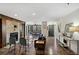 Inviting living room features a stone fireplace, hardwood floors, modern furniture, and an open-concept layout at 4676 Vinings Central Se Run # 104, Atlanta, GA 30339