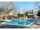 Community pool with stonework and surrounding landscaping at 4676 Vinings Central Se Run # 104, Atlanta, GA 30339