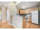 Kitchen with light wood cabinets, granite counters, and appliances at 4008 Orchard Hill Ter, Stone Mountain, GA 30083