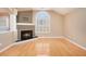 Living room with hardwood floors, fireplace, and large window at 4008 Orchard Hill Ter, Stone Mountain, GA 30083