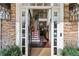 Two-story entryway with hardwood floors and view of staircase at 620 Regency Forest Ct, Atlanta, GA 30342