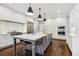 Bright kitchen with white cabinets, marble countertops, and a Wolf range at 620 Regency Forest Ct, Atlanta, GA 30342