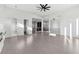 Sunlit living room with hardwood floors, high ceilings and fireplace at 744 Riverside Rd, Sugar Hill, GA 30518