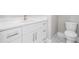 Bathroom featuring a white vanity with marble countertop and a toilet at 1010 Nours Cir, Lawrenceville, GA 30045