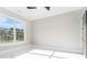 Bedroom with bright, natural light and a large window with exterior views at 1010 Nours Cir, Lawrenceville, GA 30045