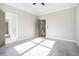 Bedroom with a carpeted floor and view of the bathroom and hallway at 1010 Nours Cir, Lawrenceville, GA 30045