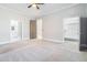 Bedroom showcasing ensuite access to a bathroom and walk-in closet at 1010 Nours Cir, Lawrenceville, GA 30045