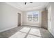 Bedroom with a carpeted floor, ceiling fan, and a view of the front yard at 1010 Nours Cir, Lawrenceville, GA 30045