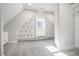 Walk-in closet features built-in shelving and a window for natural light at 1010 Nours Cir, Lawrenceville, GA 30045