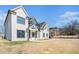 Beautiful two-story home with a well-manicured lawn and striking architectural details, perfect for Gathering living at 1010 Nours Cir, Lawrenceville, GA 30045