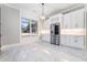 Bright kitchen with stainless appliances, eat in area and modern marble floors at 1010 Nours Cir, Lawrenceville, GA 30045