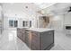 Spacious kitchen island with stainless steel sink and faucet, set in an open floorplan at 1010 Nours Cir, Lawrenceville, GA 30045