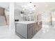 Open floor plan with large kitchen island, fireplace, and staircase at 1010 Nours Cir, Lawrenceville, GA 30045