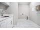 Functional laundry room with modern fixtures and ample space for appliances at 1010 Nours Cir, Lawrenceville, GA 30045