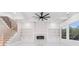 Stunning living room showcases a fireplace, custom built-ins, and a staircase with iron railings at 1010 Nours Cir, Lawrenceville, GA 30045