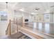 Spacious living room with hardwood floors, fireplace, built-ins, and large windows at 1010 Nours Cir, Lawrenceville, GA 30045