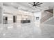 Open-concept layout featuring modern lighting, stainless steel appliances, and a sleek center island at 1010 Nours Cir, Lawrenceville, GA 30045