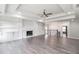 Spacious living room with fireplace, built-in shelves, and hardwood floors at 1010 Nours Cir, Lawrenceville, GA 30045