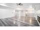 Large living room with hardwood floors, a ceiling fan, and a fireplace at 1010 Nours Cir, Lawrenceville, GA 30045