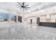 Bright living room and kitchen with modern fixtures, stainless appliances and marble floors at 1010 Nours Cir, Lawrenceville, GA 30045