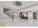 Bright living room features marble floors and modern staircase at 1010 Nours Cir, Lawrenceville, GA 30045