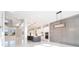 Open floor plan showcasing living room and modern kitchen with island and marble floors at 1010 Nours Cir, Lawrenceville, GA 30045