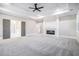 Open main bedroom with a fireplace, tray ceiling, and access to the bathroom at 1010 Nours Cir, Lawrenceville, GA 30045
