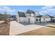 Beautiful home featuring a driveway, covered patio, and expansive backyard space at 1010 Nours Cir, Lawrenceville, GA 30045