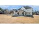 Elegant home with a covered patio, large windows, and a sprawling backyard at 1010 Nours Cir, Lawrenceville, GA 30045