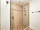 Bathroom with a glass shower door and tile surround at 1170 Brookhaven Woods Ne Ct, Atlanta, GA 30319