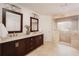 Double vanity bathroom with dark brown cabinets and a large shower at 1170 Brookhaven Woods Ne Ct, Atlanta, GA 30319