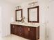Double vanity bathroom with dark brown cabinets and a large shower at 1170 Brookhaven Woods Ne Ct, Atlanta, GA 30319