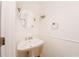 Charming powder room with pedestal sink and oval mirror at 1170 Brookhaven Woods Ne Ct, Atlanta, GA 30319