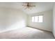Bright bedroom with neutral walls, carpet, and ceiling fan at 1170 Brookhaven Woods Ne Ct, Atlanta, GA 30319