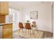 Bright dining area with glass table and four brown chairs at 1170 Brookhaven Woods Ne Ct, Atlanta, GA 30319