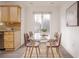 Bright dining area with glass table and four brown chairs at 1170 Brookhaven Woods Ne Ct, Atlanta, GA 30319