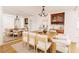Bright dining room with large wooden table, mirrors and hardwood floors at 1170 Brookhaven Woods Ne Ct, Atlanta, GA 30319