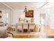 Bright dining room with large wooden table, mirrors and hardwood floors at 1170 Brookhaven Woods Ne Ct, Atlanta, GA 30319