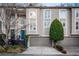 Attractive townhome with 2-car garage and landscaped front at 1170 Brookhaven Woods Ne Ct, Atlanta, GA 30319