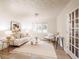Bright living room features a comfy sofa, stylish rug, and natural light at 1170 Brookhaven Woods Ne Ct, Atlanta, GA 30319