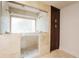 Large walk-in shower with built-in seat and window at 1170 Brookhaven Woods Ne Ct, Atlanta, GA 30319