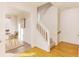 Elegant staircase with white railings and hardwood floors at 1170 Brookhaven Woods Ne Ct, Atlanta, GA 30319