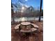 Stone patio furniture overlooking a frozen pond at 344 Bells Ferry Ne Rd, White, GA 30184