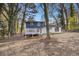 Spacious backyard with large deck and wooded surroundings at 3506 Crown Point Pl, Decatur, GA 30032